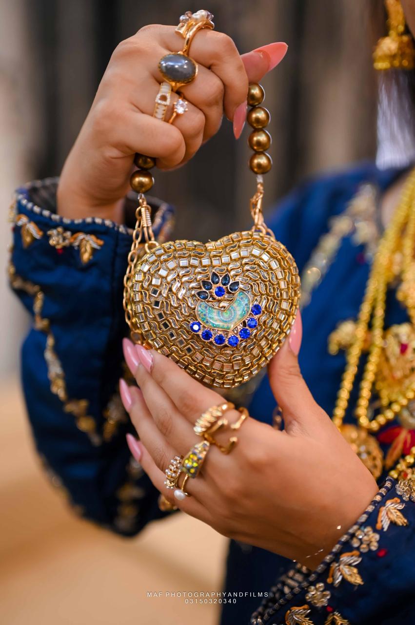 Noor-e-Peacock Heart Embellished kundan clutch