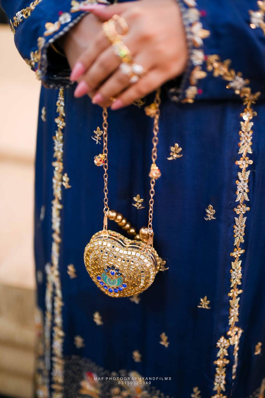 Noor-e-Peacock Heart Embellished kundan clutch
